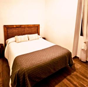 a bedroom with a large bed in a room at El Mirador de Teo in Alocén