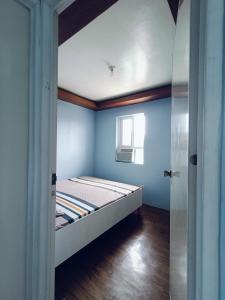 Ένα ή περισσότερα κρεβάτια σε δωμάτιο στο Camella transient house