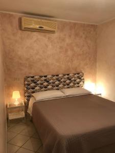 Postel nebo postele na pokoji v ubytování b&b ar colle 2