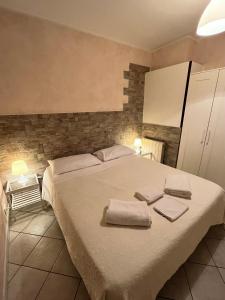Postel nebo postele na pokoji v ubytování b&b ar colle 2