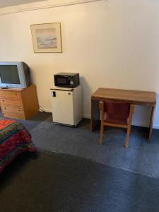 Kuchyň nebo kuchyňský kout v ubytování Tacoma Center Motel