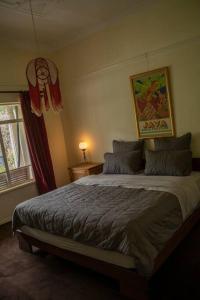 a bedroom with a large bed in a room at Art House On The Park in Melbourne