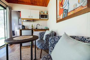 a small kitchen with a table and chairs in a room at Meadowbrook Tiny House - Stay among the best wineries in Orange in Orange