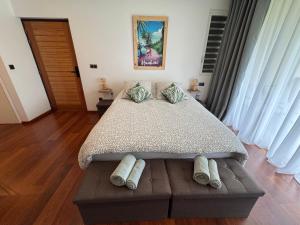 Postel nebo postele na pokoji v ubytování TITOU LODGE - Hauteurs de Miri