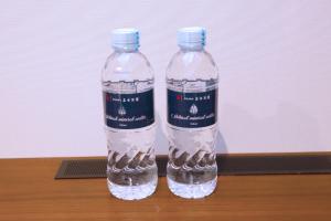 two bottles of water sitting on top of a table at goom Hotel Fukuoka-Kokusai-Center in Fukuoka +27 photos