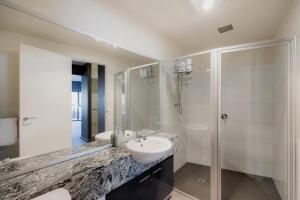 a bathroom with a sink and a shower at Inner-city 2 bedroom apartment - perfectly located in Hobart +31 photos
