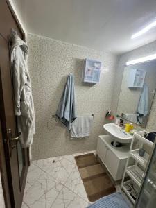 a bathroom with a sink and a mirror at Appartement Dari proche du centre ville in Agadir +20 photos