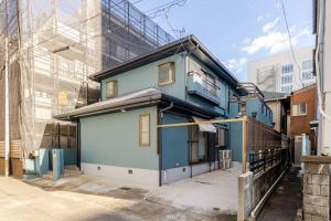 a blue house in the middle of a city at ドリームホテル大博 in Fukuoka