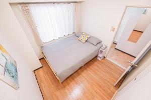 Кровать или кровати в номере 新宿歌舞伎町徒步三分鐘三房一廳近鄰伊勢丹
