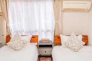 Een bed of bedden in een kamer bij 新宿区歌舞伎町伊势丹徒步3分钟#6
