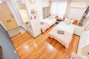 Een bed of bedden in een kamer bij 新宿区歌舞伎町伊势丹徒步3分钟#6