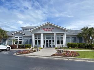 a building with a sign on the front of it at Summer Bookings Available NOW! Going Fast! in Calabash