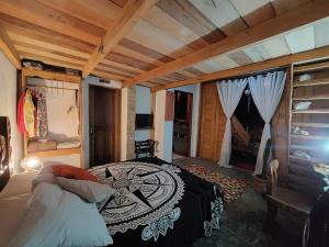 a bedroom with a bed in a room at Xodó Tiny House in Marau