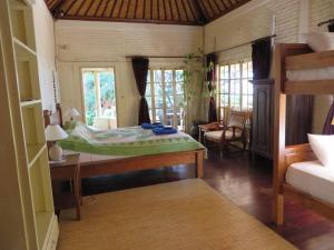 Krevet ili kreveti u jedinici u okviru objekta Jukung Dive Resort Bali AMED