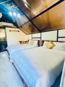 Ένα ή περισσότερα κρεβάτια σε δωμάτιο στο 86 Homestay Phan Thiết