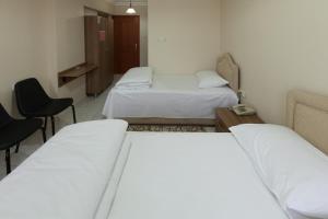 A bed or beds in a room at Gizem Pansiyon