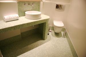 a bathroom with a sink and a toilet at Xenon Estate in Spetses