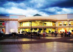 a large building with people standing outside of it at casa en la Cima in San Salvador