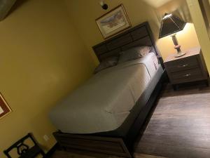 a bedroom with a bed and a night stand with a lamp at Downtown Cleveland Historic District in Cleveland