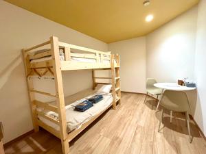 Postel nebo postele na pokoji v ubytování 尾道stay源 -MINAMOTO-