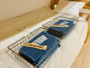 Postel nebo postele na pokoji v ubytování 尾道stay源 -MINAMOTO-