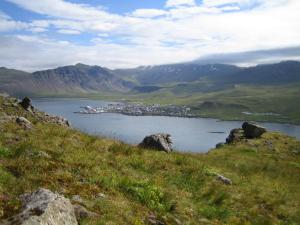 a view of a large body of water with a town at G4 Apartment in Grundarfjordur