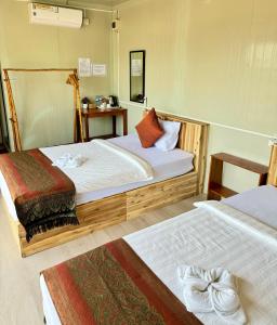 Postel nebo postele na pokoji v ubytování Naroth Beach Bungalow