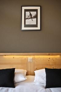 Postelja oz. postelje v sobi nastanitve Helvetia hotel