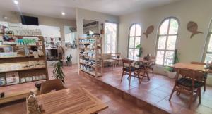 a room with tables and chairs in a store at ISLA INDAH RETREAT boutique hotel in Nusa Lembongan