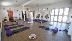 a room with purple pilates mats on the floor at ISLA INDAH RETREAT boutique hotel in Nusa Lembongan