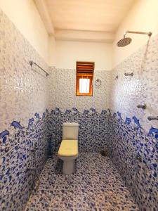 a bathroom with a toilet and a shower at Rasana Breezt Villa in Matara