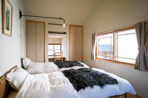 Postel nebo postele na pokoji v ubytování Une stay&diner