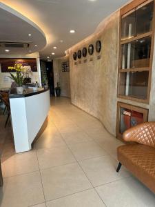 a lobby with a counter in a restaurant at Mizie Hotel Kuala Lumpur in Kuala Lumpur