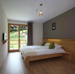 Postelja oz. postelje v sobi nastanitve Helvetia hotel