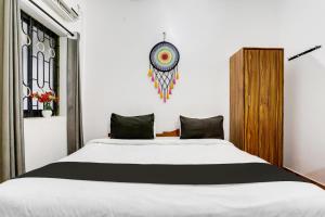 Postel nebo postele na pokoji v ubytování Hotel O Sai Deep Place + 21 fotografií