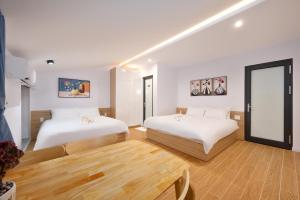 Postel nebo postele na pokoji v ubytování An Bang Spa & Apartment