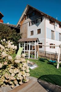 a large white building with a playground in front of it at Liebevolles renoviertes Haus anno 1858! in Thüringen +68 photos