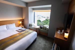 Giường trong phòng chung tại Fujisan Mishima Tokyu Hotel