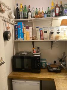 a microwave sitting on a counter in a kitchen at Walsingham Bakehouse in Little Walsingham +32 photos