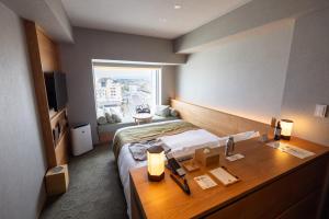 Giường trong phòng chung tại Fujisan Mishima Tokyu Hotel