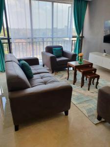 a living room with a couch and a table at The Heart of Urban in Nairobi
