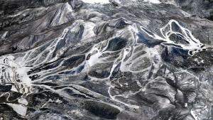 an aerial view of a snow covered mountain range at Urabandai Cranes in Kitashiobara