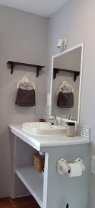 a bathroom with a sink and a mirror at House in Rodalquilar valley in Rodalquilar