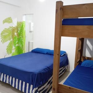 Ένα ή περισσότερα κρεβάτια σε δωμάτιο στο Pousada Morro dó Macaco ARTE