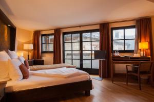 Säng eller sängar i ett rum på Hotel Schloss Waldeck