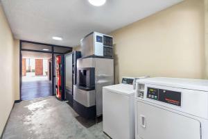 a kitchen with stainless steel appliances in a room at Econo Lodge Kennett in Kennett