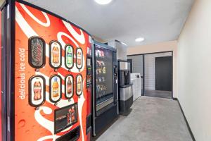 a room with a soda vending machine in a kitchen at Econo Lodge Kennett in Kennett