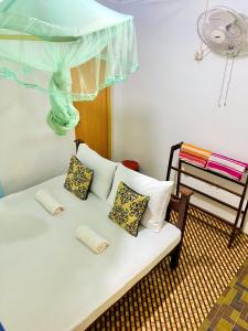 Postel nebo postele na pokoji v ubytování Sigiri Lakshan Home Stay