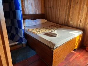 Letto o letti in una camera di Kribi-Lodge