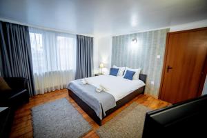 Postel nebo postele na pokoji v ubytování Velinov Boutique Hotel